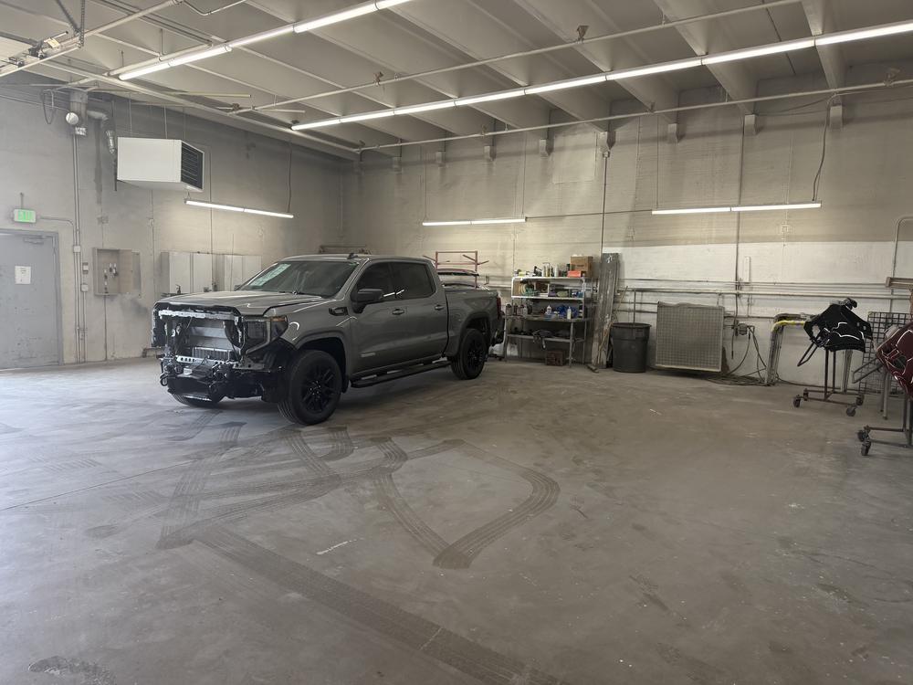 Collision repair in progress inside the Alpine Chevrolet body shop