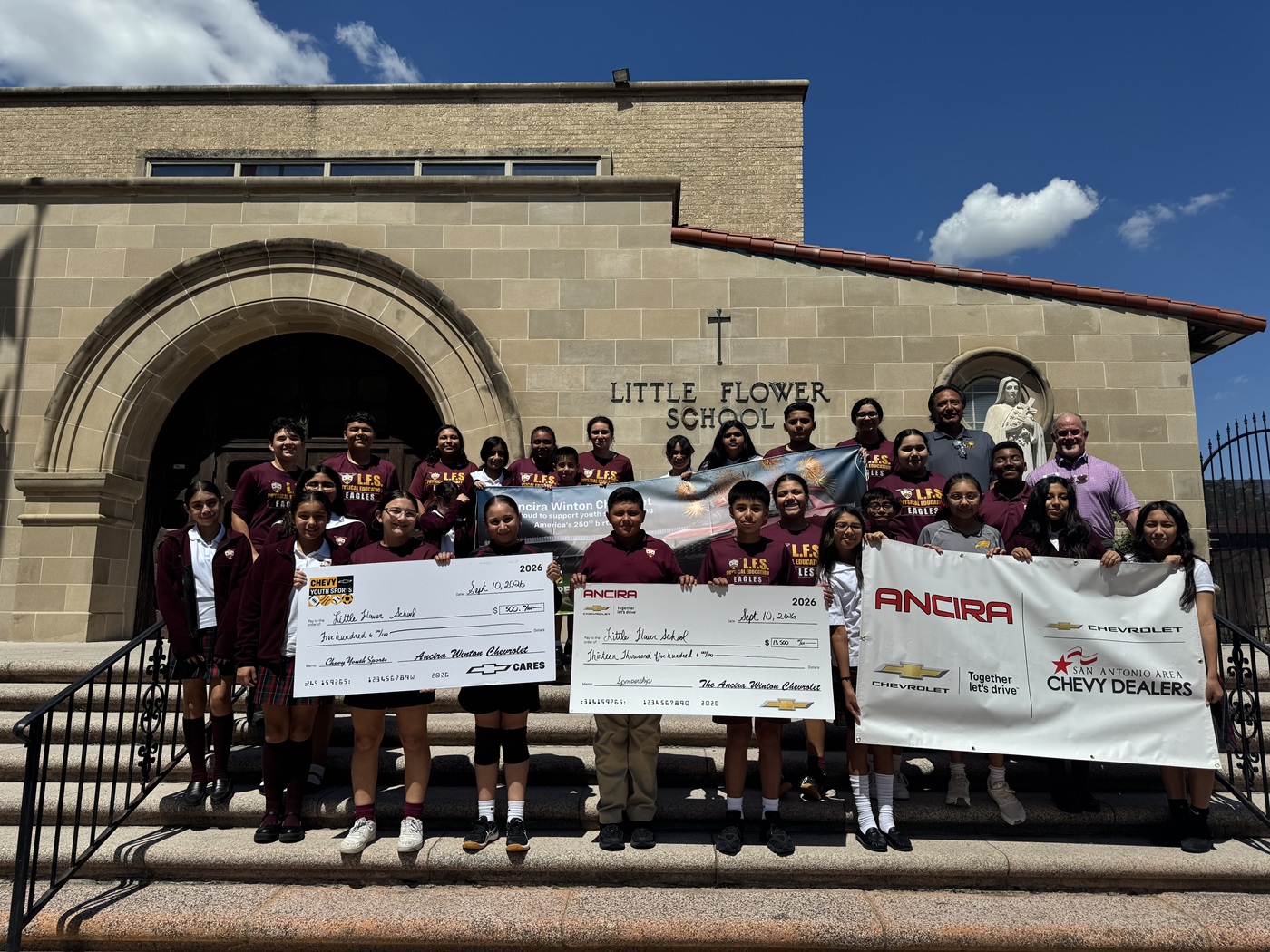 Darrell presenting a check for $13,500 to St. John Bosco Elementary School, which is where the Spurs Nuns work.