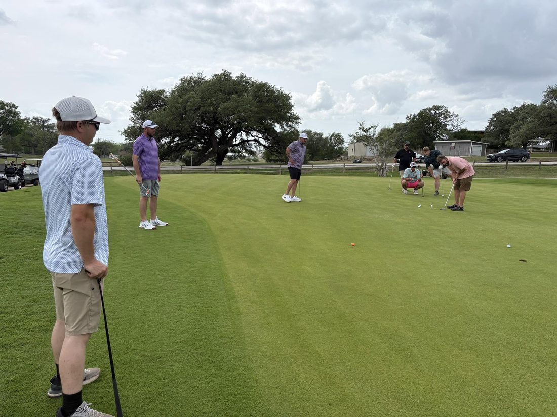 Golfers on the green during the Swing for St. Michael's tournament sponsored by Ancira