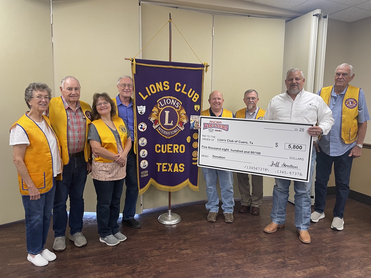 Jeff presenting a $5,800 donation check to the Lions Club of Cuero