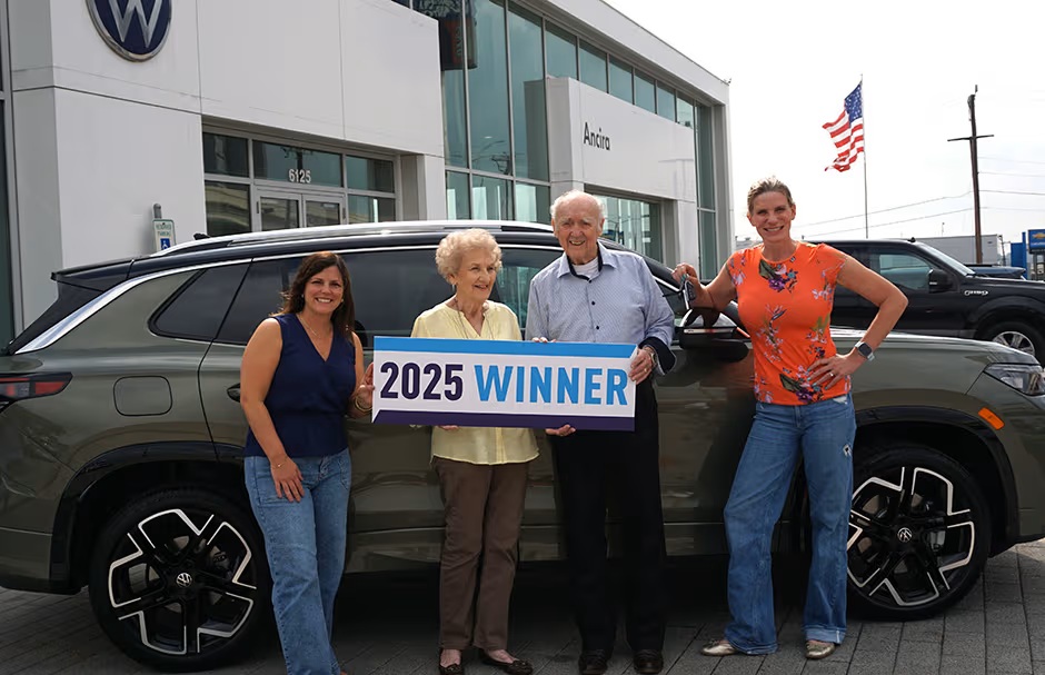 Drive Away for Education winner with their new vehicle